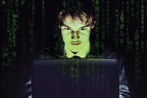 evil man on laptop